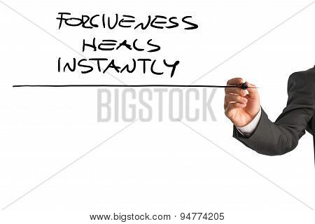 Professional Therapist Writing A Forgiveness Heals Instantly Saying
