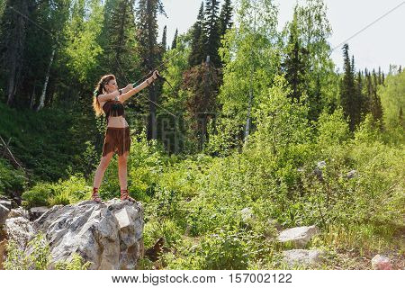 Young Beautiful Amazon Girl Hunting In The Forest