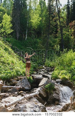 Young Beautiful Amazon Girl Hunting In The Forest