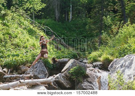 Young Beautiful Amazon Girl Hunting In The Forest