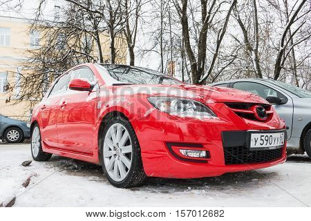 Smolensk, Russia - November 12, 2016: Mazda 3 (Axela) parked in winter street. Compact car manufactured in Japan by Mazda.