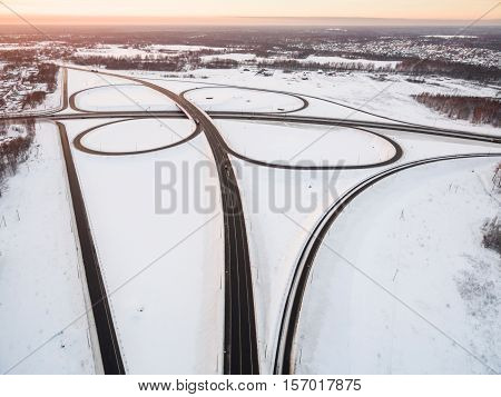 winter road junction in the countryside aerial view  in the form of butterfly