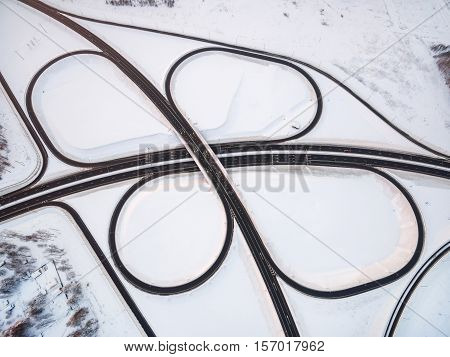 winter road junction in the countryside aerial view  in the form of butterfly