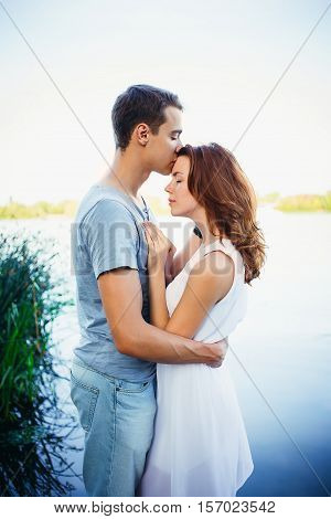 Handsome Young Man Kissing His Girlfriend