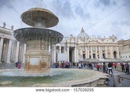 ST.PETER VATICAN ROME ITALY - NOVEMBER 8 : tourist taking a photo in front of stpeter basilica church on november 8 2016 in rome italy