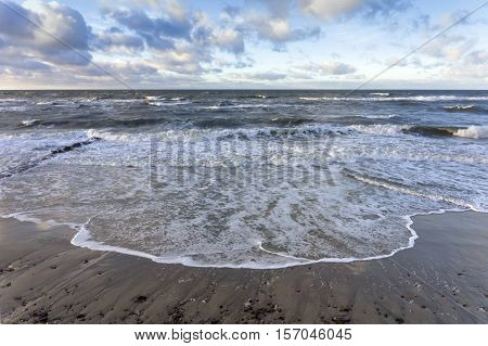 the waves of the sea Sunny day, beautiful clouds