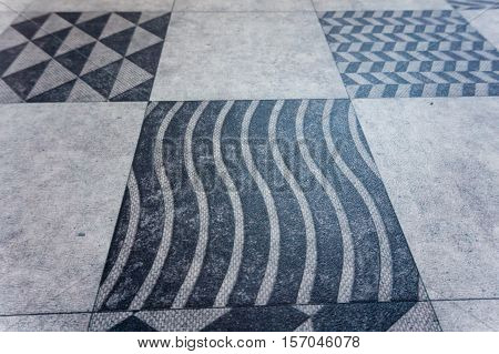 a big grey background squares with geometric pattern