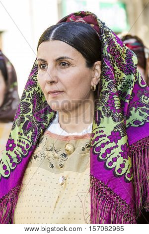 QUARTU S.E., ITALY - September 17, 2016: Parade of Sardinian costumes and floats for the grape festival in honor of the celebration of St. Helena. - Sardinia - portrait of a beautiful woman in traditional Sardinian costume