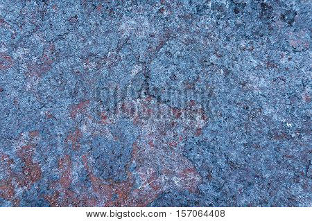 Vintage blue metal background with yellow spot.