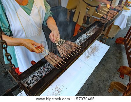 Woman During The Preparation Of Street Food