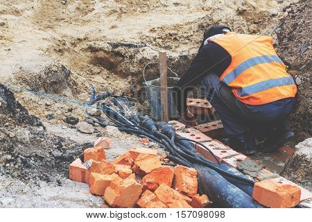 Construction Work, Construction Worker Carries Out The Masonry Bricks