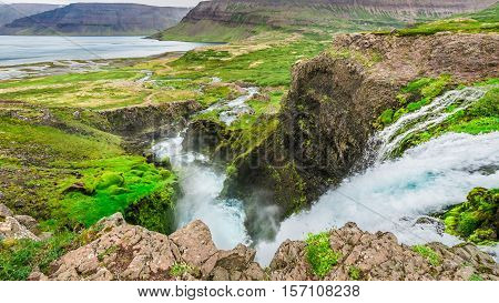 Waterfall Flowing Into A Valley In Iceland