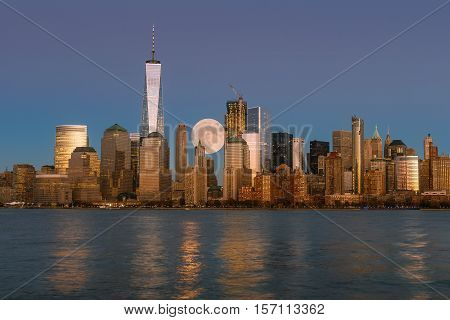 Perigee full moon over the skyscrapers of lower Manhattan-New York.