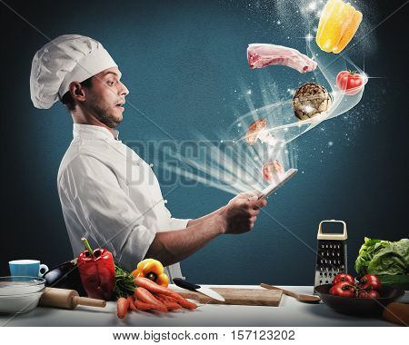 Chef reads a food recipe from the tablet