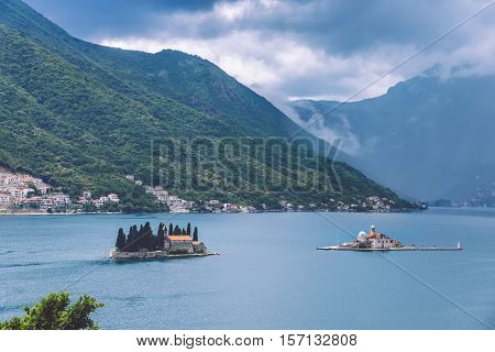 Our Lady Of The Rocks and Saint George islets near Perast on Kotor Bay. Saint George Benedictian monastery and Roman Catholic Church of Our Lady Of the Rocks are situated on the islands.