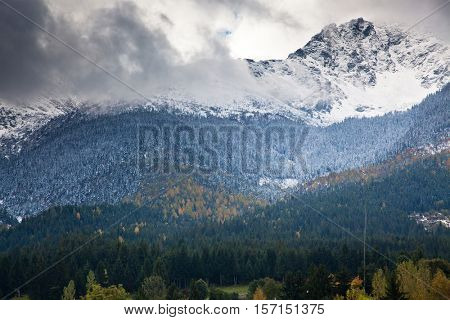 view on foggy valley in winter from Rodna Mountains in Transylvania - Romania