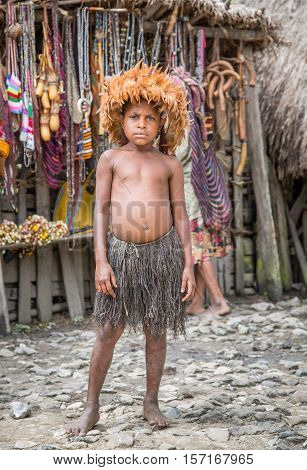 Wamena, Jayapura, Indonesia, February 13th, 2016: Dani tribe girl in traditional clothing