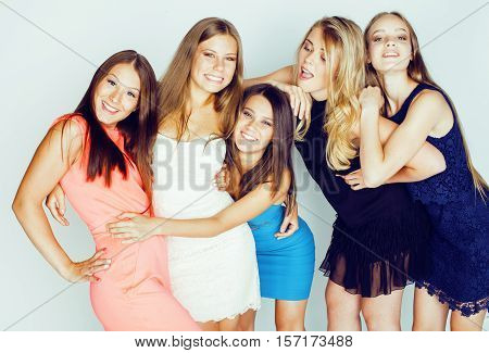group of many cool modern girls friends in bright clothers together having fun isolated on white background, happy smiling lifestyle people concept