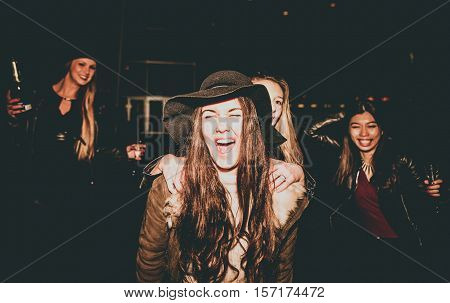 Four girls making party outdoor in the night