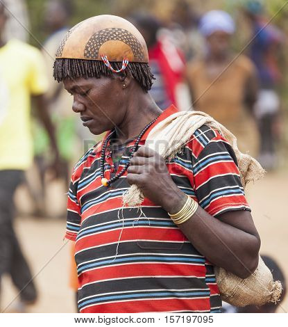 Ari Woman In Calabash Hat/helmet At Village Market. Bonata. Omo Valley. Ethiopia.