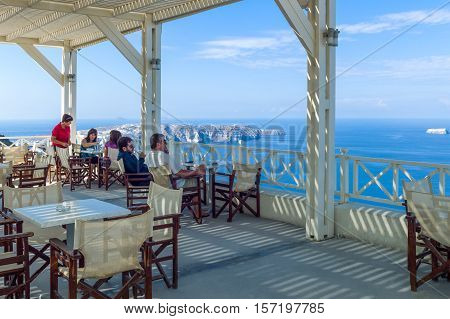 Santorini Greece - October 13 2012: Tourists in a wine house near Pirgos village