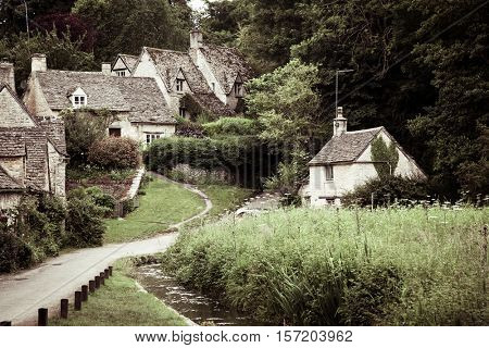 Traditional Cotswold cottages in England, UK. Bibury is a village and civil parish in Gloucestershire, England.