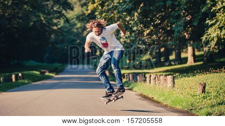 Action Shot Of A Skateboarder Skating, Doing Tricks And Jumping