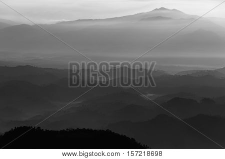 A black & white of a layer of mountain