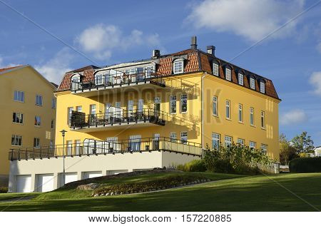 Nynashamn - a view of a colorful buildings on a public park. Nynashamn is located far south in Sodertorn, 58 kilometers south of Stockholm.