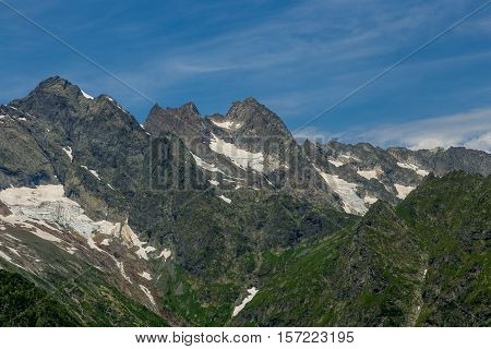 Snow in summer on cliffs in mountain Abkhazia