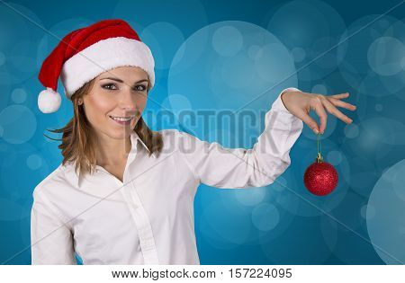 Christmas Woman. Beautiful fashion model with hat Santa Claus.