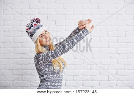 Woman In Winter Cap Strecthing Out