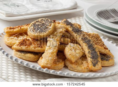 Homemade salty cheese cookies covered with sesame and poppy seeds.