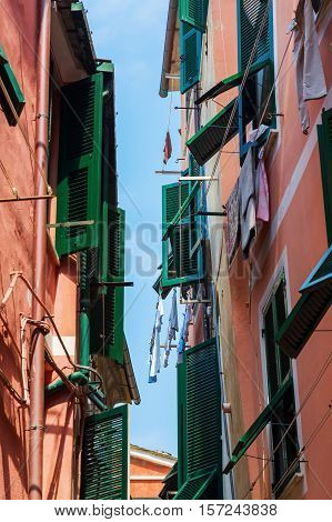 picturesque scene of old houses with shuttered windows in Vernazza, Cinqueterre, Italy