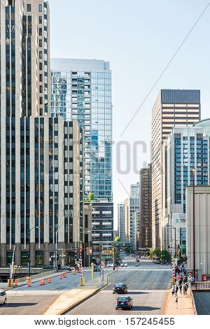 Chicago, USA - May 30, 2016: View of Wacker Drive with bridge, skyscrapers, people and cars in downtown
