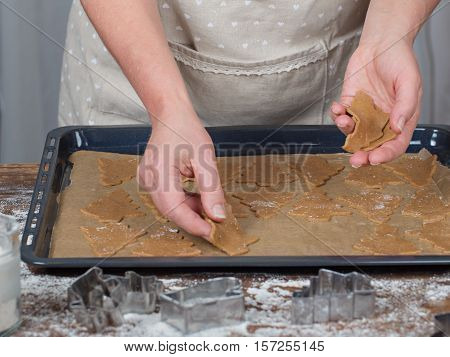 Women's hands making christmas cookies. Tradicional xmas dessert