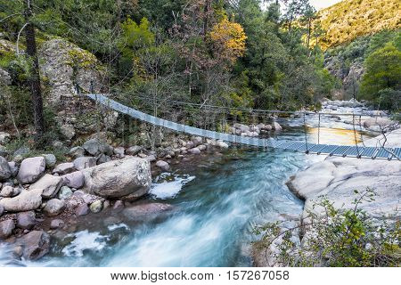Steel Rope Bridge Across La Figarella At Bonifatu In Corsica