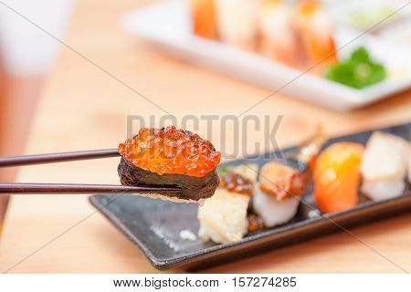 Sushi With Chopsticks.