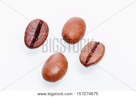 Macro coffee beans isolated on white background