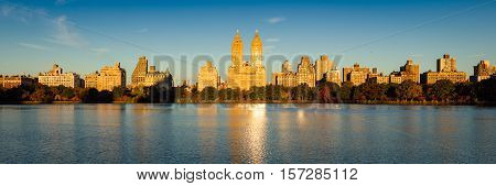 Fall in Central Park at the Jacqueline Kennedy Onassis Reservoir. Panoramic morning view with colorful autumn foliage on the Upper West Side, Manhattan, New York City