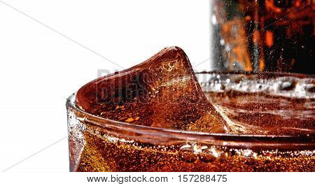 Cola with the ice in a glass, white background