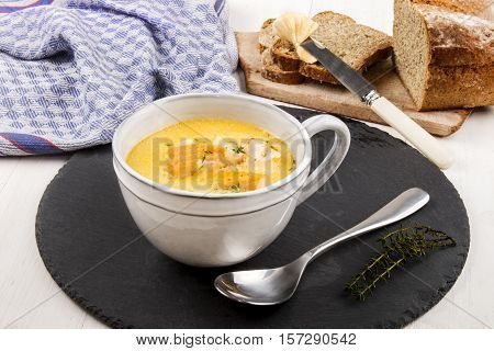 specialty from scotland freshly cooked cullen skink with thyme in a mug on slate