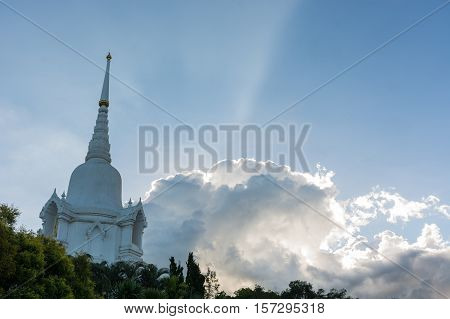 White pagoda which contain Buddha's relics with beautiful blue sky background in Phichit Thailand.