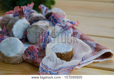 Close up of homemade polvoron typical sweets consumed in Spain at Christmas. Spanish shortbread on wood background.