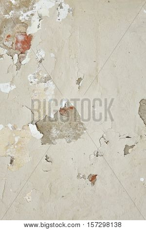 Dark Plaster Wall With Dirty White Black Scratched Vertical Texture. Old Brickwall With Peel Off Grey Stucco Background. Vintage Retro Worn Urban Wall. Abstract Decayed Cracked Rough Surface.