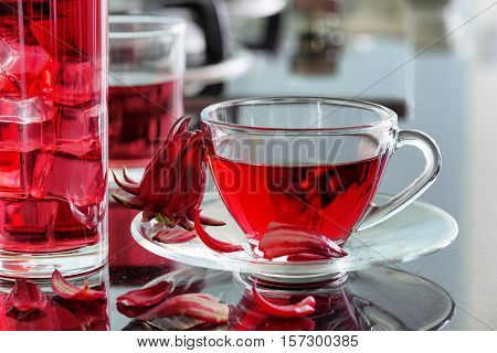 Cup Of Hibiscus Tea (rosella, Karkade) On Kitchen Table
