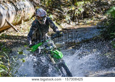 VLADIVOSTOK, RUSSIA - OCTOBER 10: competition On the edge 2016 Hard Enduro Rally with a KTM motorcycle. The hardest enduro rally in the world. October 10, 2016 in Vladivostok, Russia