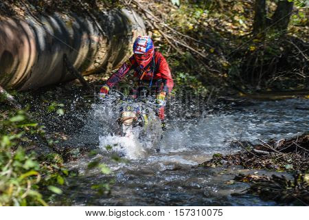 VLADIVOSTOK, RUSSIA - OCTOBER 10: competition On the edge 2016 Hard Enduro Rally with a KTM motorcycle. The hardest enduro rally in the world. October 10, 2016 in Vladivostok, Russia