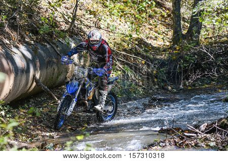 VLADIVOSTOK, RUSSIA - OCTOBER 10: competition On the edge 2016 Hard Enduro Rally with a KTM motorcycle. The hardest enduro rally in the world. October 10, 2016 in Vladivostok, Russia