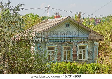 A house in the village surrounded by trees
